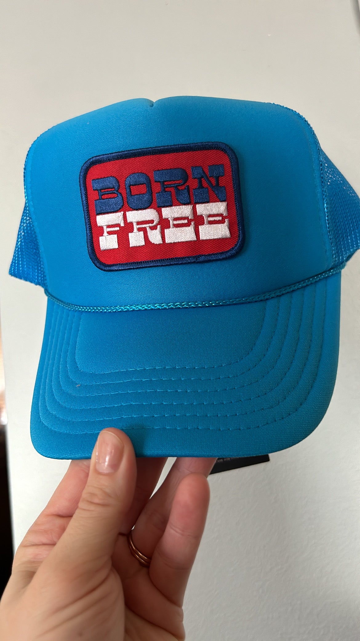 Born free neon blue trucker