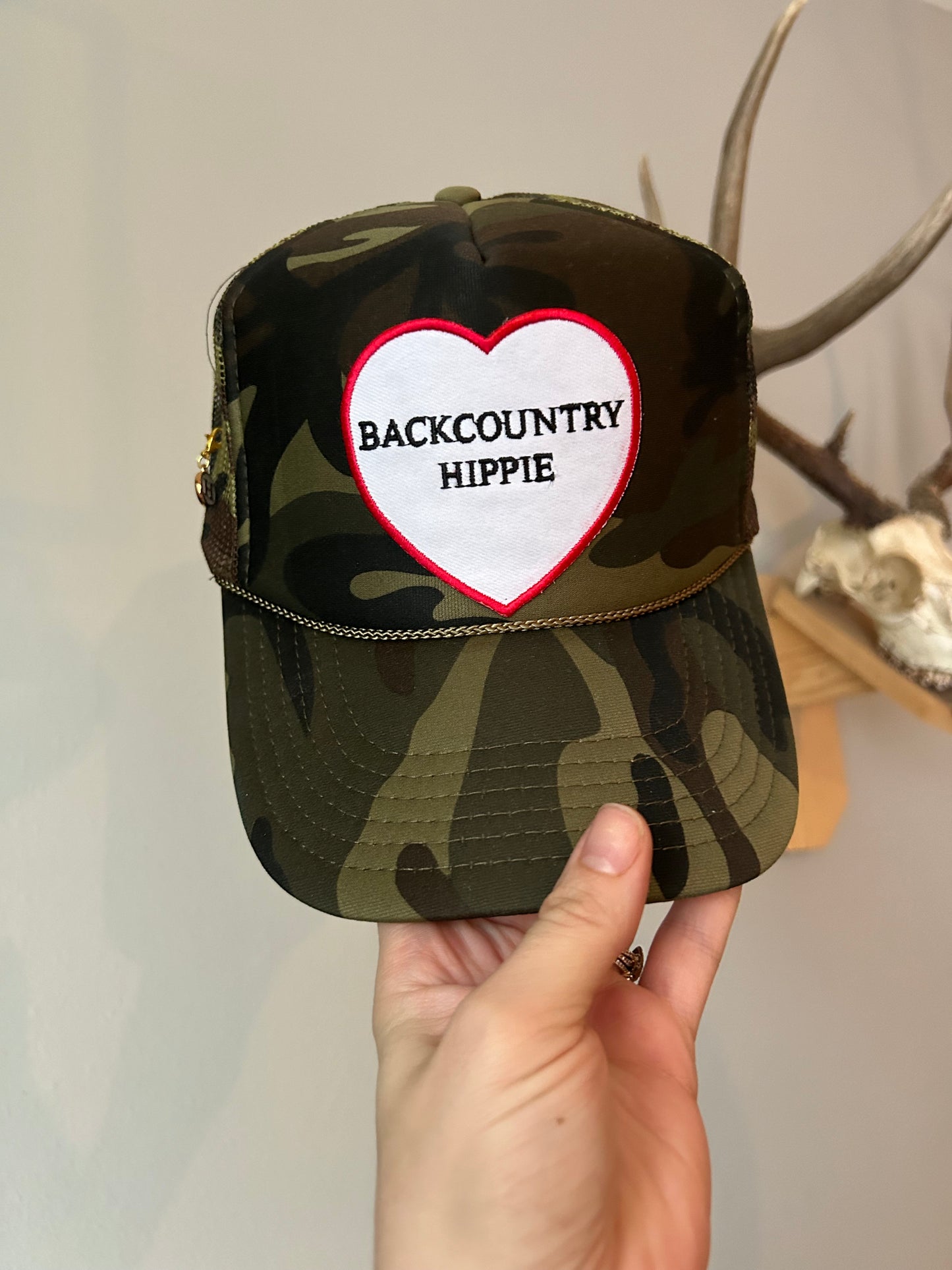 BCH heart camo trucker